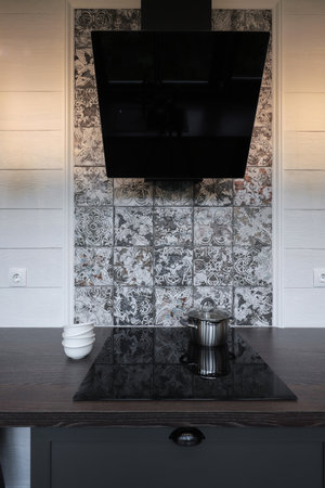 Saucepan on electric stove in the modern kitchenの写真素材