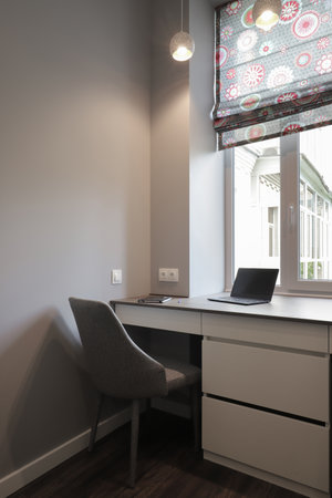 Laptop on table in the modern room interiorの写真素材