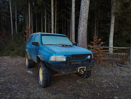 Old SUV car with winch in the forestの写真素材