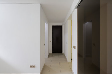 Empty corridor with white walls inside the houseの写真素材