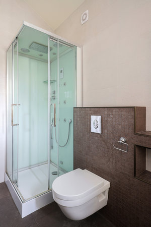Bathroom interior with shower cabin and white toiletの写真素材