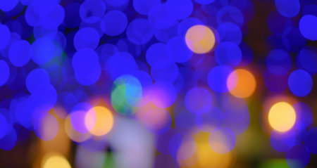 Abstract blur city night club blue green yellow white purple bokeh light background. Horizontal...