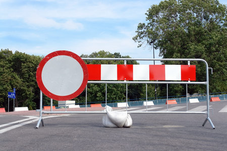 Metal red stripe road barrier with no vehicles roadsign