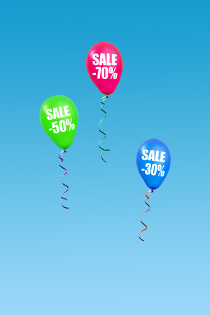 Three colorful ballons rising in the air announcing seventy, fifty and thirty percent sale over sclear blue skyの写真素材