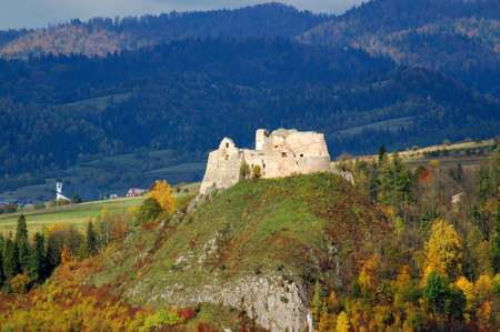 Ruins of medieval royal castle located on rocky hill in Czorsztyn, Poland - bird's viewの写真素材