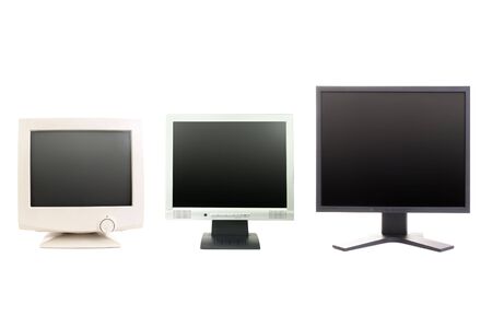 One CRT and two LCD monitors over white backgroundの写真素材