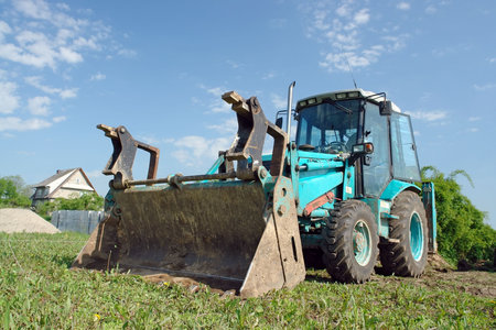 Backhoe loader parked in the field
