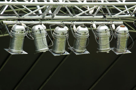 Multiple stage spotlight arrangement over blackの写真素材