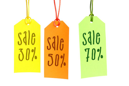 Three color tags spelling 30, 50 and 70 sale over white background