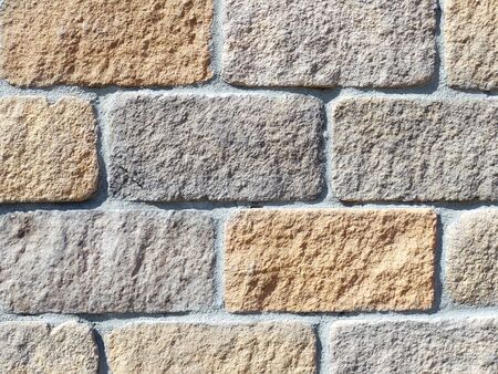 Closeup shot of house wall made from cut stone blocksの写真素材