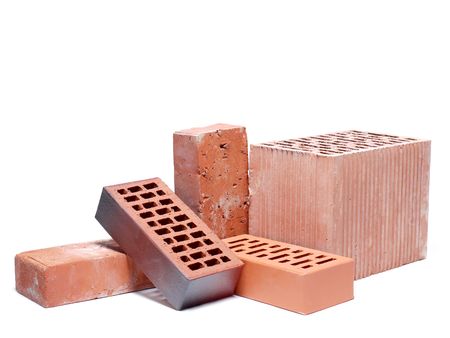 Solid and perforated bricks shot over white backgroundの写真素材