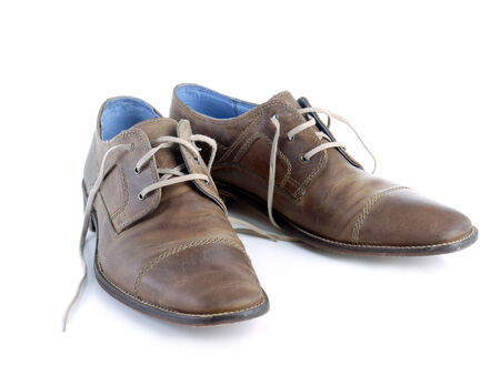 Pair of male light brown leather shoes shot on white background                               の写真素材