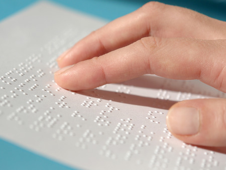 Blind woman reading text in braille
の写真素材