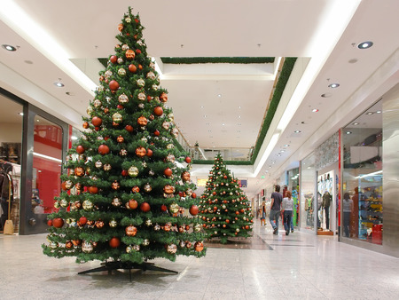 Shopping mall interior decorated with christmas treesのeditorial素材