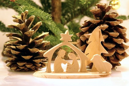 Christmas crib figures curved from wood representing Holy Family and animalsの写真素材