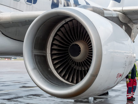 Closeup of passenger airplane engine parked at the airport