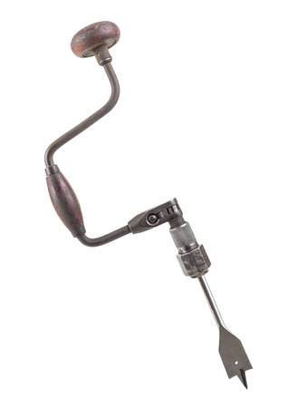 Old hand drill with attached spade wood drill bit shot on whiteの写真素材