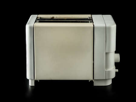 Old grunge toaster over black backgroundの写真素材