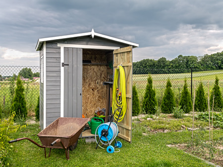 Wooden shed with different garden tools and equipmentの写真素材