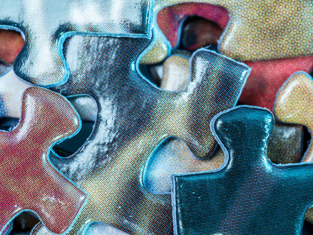 Background of scattered colorful puzzle piecesの写真素材
