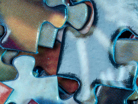 Background of scattered colorful puzzle pieces