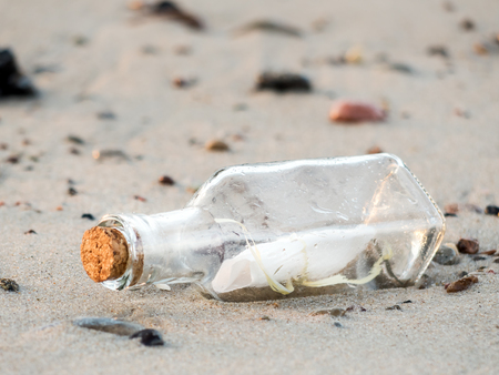 Message in the bottle washed ashoreの写真素材