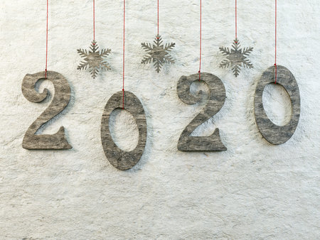 Wooden cut-out 2020 New Year date hanging against the wall on red strings