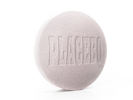 3D rendering of pink placebo tablet on whiteの写真素材