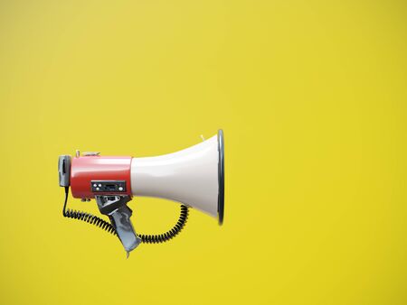 Side shot of megaphone against yellow backgroundの写真素材