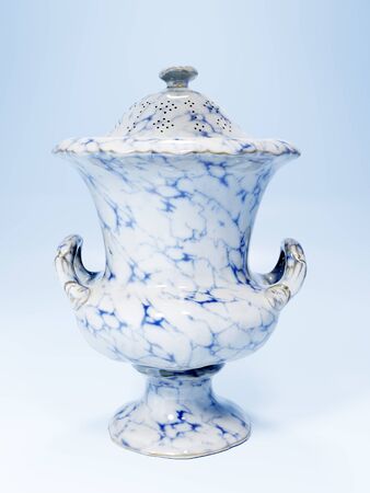 Vintage marbled pharmacy leech jar on light blue backgroundの写真素材