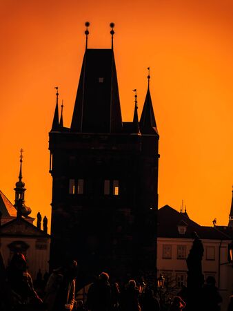 Silhouette of Charles Bridge tower at the sunrise, Prague, Czech Republicの写真素材