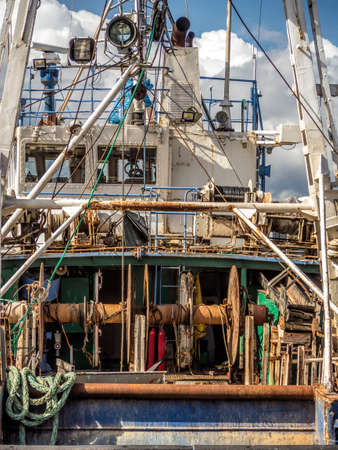 Closeup of fishing smack docked at the harborの写真素材