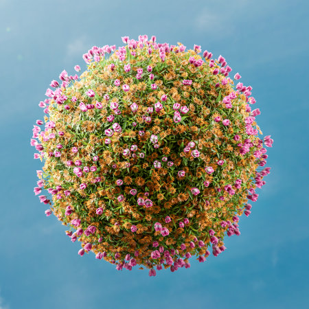 3D rendering of sphere covered with fresh pink and orange flowers against blue sky - Little Planet conceptの写真素材