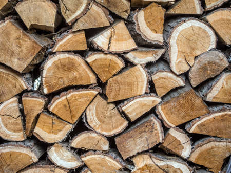 Closeup of piled and chopped oak firewoodの写真素材