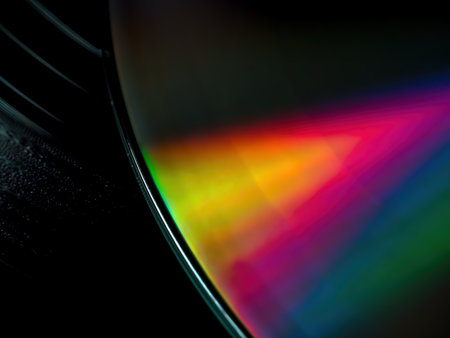 Closeup of CD-rom disk on black retro vinyl recordの写真素材