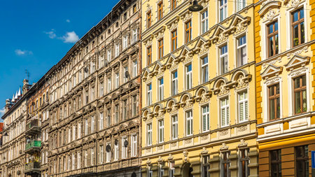Historic row of colorful European buildings showcasing ornate architectural details including wrought iron balconies and decorative facades, in a picturesque cityscape, Wroclaw, Polandの写真素材