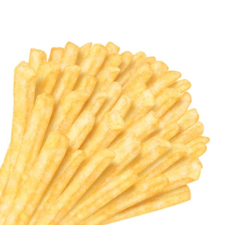 Bunch of french fries in the corner, on white backgroundの写真素材