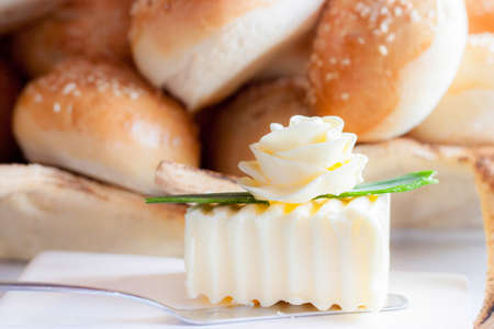 Decorated piece of butter with baking at backgroundの写真素材