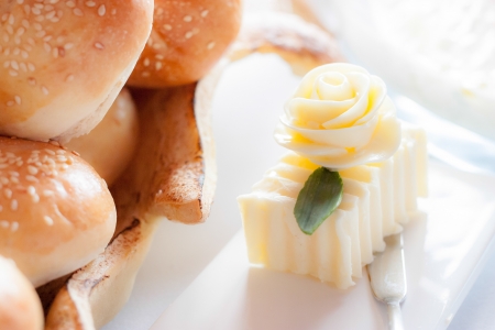 Decorated piece of butter with baking at backgroundの写真素材
