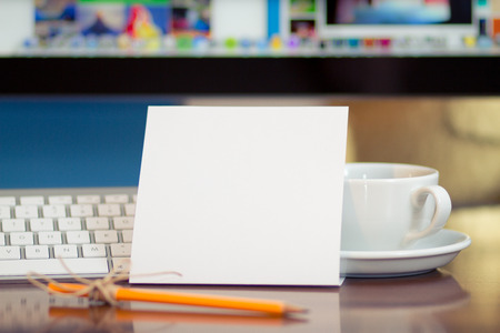 Message on the piece of paper  PC display and coffee cup at backgroundの写真素材