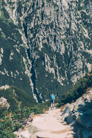 Boy walking down the mountains