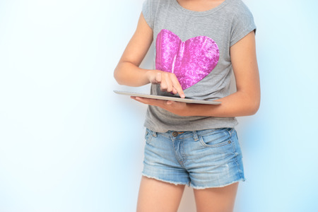 Close shot of girl using a mobile deviceの写真素材