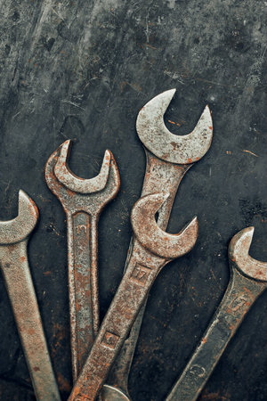 Spanners on steel surface. Old rusty wrenches for maintenance. Mechanic hardware tools to fix....