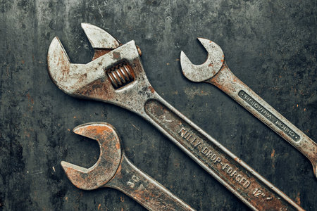 Spanners on steel surface. Old rusty wrenches for maintenance. Mechanic hardware tools to fix....
