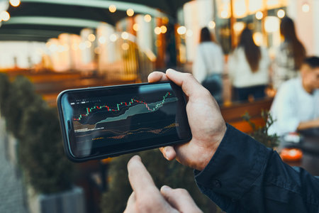 Person investing trading on stock cryptocurrency market using investing application on smartphone....