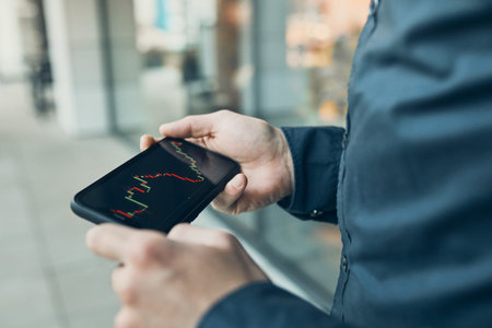 Person investing trading on stock cryptocurrency market using investing application on smartphone....