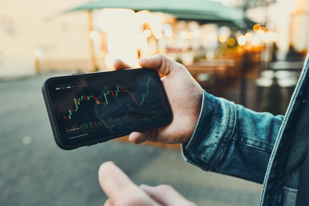 Person investing trading on stock cryptocurrency market using investing application on smartphone....