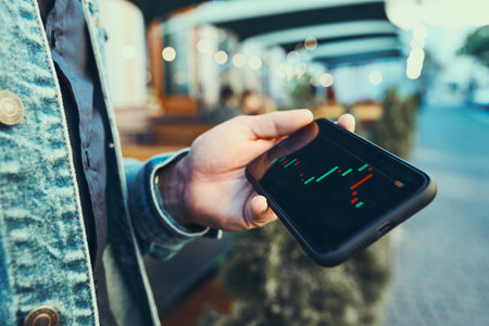 Person investing trading on stock cryptocurrency market using investing application on smartphone....