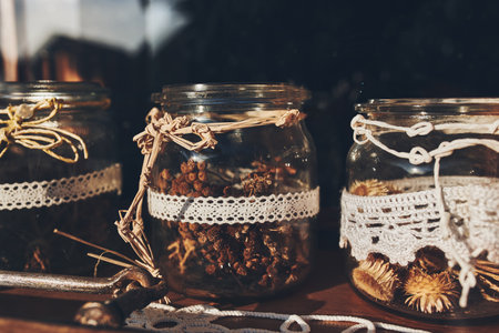 Assorted dried herbs in jars for making herbal tea. Alternative medicineの写真素材