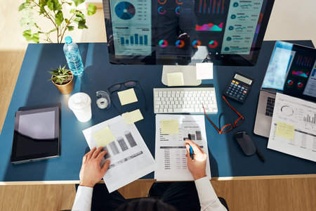 Businessman entrepreneur working with data on charts and graphs on computer screen. Man using...